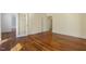 Well-lit living room with classic hardwood floors, offering a warm and inviting space at 419 Eagle Point Rd, Pittsboro, NC 27312