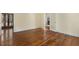 Spacious living room featuring hardwood floors and a view of the fireplace through the doorway at 419 Eagle Point Rd, Pittsboro, NC 27312