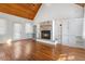 Comfortable living room with a wood paneled vaulted ceiling and a stone fireplace at 419 Eagle Point Rd, Pittsboro, NC 27312