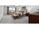 Inviting main bedroom with tray ceiling, large windows, neutral decor, and a comfortable seating area at 424 Providence Springs Ln, Fuquay Varina, NC 27526