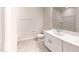 Bathroom featuring a single sink vanity and a view of the tub at 46 Coffee Tree Cir, Clayton, NC 27527
