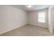 Bedroom features neutral walls, plush carpeting, and natural light at 46 Coffee Tree Cir, Clayton, NC 27527