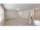 Spacious bonus room features neutral walls, plush carpeting, and great natural light at 46 Coffee Tree Cir, Clayton, NC 27527