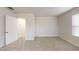 Cozy bonus room features plush carpet, neutral walls, and bright windows at 46 Coffee Tree Cir, Clayton, NC 27527