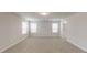 Large bonus room offers plush carpet, recessed lighting, and great natural light at 46 Coffee Tree Cir, Clayton, NC 27527