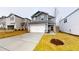 Charming two-story home with a spacious driveway and manicured front yard, showcasing modern architecture and curb appeal at 46 Coffee Tree Cir, Clayton, NC 27527