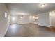 Open-concept area showcasing hardwood floors, recessed lighting, views of the staircase, and an adjacent modern kitchen at 46 Coffee Tree Cir, Clayton, NC 27527