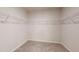 Walk-in closet with carpeted floor and wire shelving at 46 Coffee Tree Cir, Clayton, NC 27527
