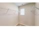 Spacious walk-in closet featuring wire shelving and a bright window at 46 Coffee Tree Cir, Clayton, NC 27527