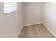Walk-in closet with carpeted floor, wire shelving, and a window at 46 Coffee Tree Cir, Clayton, NC 27527