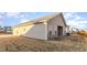 The home features a spacious backyard with a covered patio and vinyl siding at 504 Rhino Bnd, Oxford, NC 27565