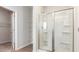Bathroom showcasing a glass shower and wire shelving in an attached walk-in closet at 504 Rhino Bnd, Oxford, NC 27565