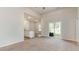 An open floorplan featuring a kitchen with a breakfast bar and a view of a sliding glass door at 504 Rhino Bnd, Oxford, NC 27565