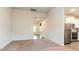Open-concept living space flows into a modern kitchen with stainless steel appliances, with carpet flooring at 504 Rhino Bnd, Oxford, NC 27565