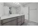 Modern bathroom featuring dual sinks, sleek cabinets, and a spacious shower at 505 Providence Springs Ln, Fuquay Varina, NC 27526