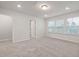 Bright bedroom with natural light, neutral walls and carpeted flooring at 505 Providence Springs Ln, Fuquay Varina, NC 27526