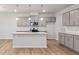 Well-lit kitchen featuring granite countertops, stainless appliances, and an island at 505 Providence Springs Ln, Fuquay Varina, NC 27526