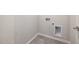 Functional laundry room with tile flooring and hookups for a washer and dryer, for added convenience at 505 Providence Springs Ln, Fuquay Varina, NC 27526