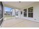 Covered back patio provides an outdoor entertaining area, screened-in with a view of the backyard at 505 Providence Springs Ln, Fuquay Varina, NC 27526