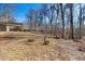 Expansive backyard with mature trees offering privacy and shade at 513 W Glendale St, Siler City, NC 27344