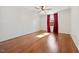 Bedroom featuring hardwood floor, natural light, and closet space, creating a calm atmosphere at 513 W Glendale St, Siler City, NC 27344