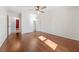 Bedroom featuring a hardwood floor, large window, and closet, offering a calm retreat at 513 W Glendale St, Siler City, NC 27344