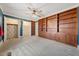 Bedroom with custom built-in shelving for displaying books and personal items, and large closets at 513 W Glendale St, Siler City, NC 27344