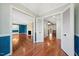 A home entryway offers hardwood floors and open access to the living room and other areas of the house at 513 W Glendale St, Siler City, NC 27344