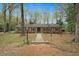 Charming brick home with a well-manicured front yard and mature trees at 513 W Glendale St, Siler City, NC 27344