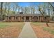 Charming brick ranch with a long walkway and beautiful curb appeal at 513 W Glendale St, Siler City, NC 27344