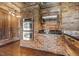 Brick wall features built-in ovens and wood cabinets at 513 W Glendale St, Siler City, NC 27344