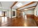 Bright living room features a brick fireplace and beautiful hardwood floors at 513 W Glendale St, Siler City, NC 27344