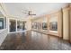 Charming sun room with brick floors, a ceiling fan, and lots of windows that let in lots of natural light at 513 W Glendale St, Siler City, NC 27344