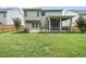 The backyard features a patio, garden beds, screened in porch, and lawn at 622 Lone Pine Loop, Fuquay Varina, NC 27526