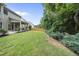 The home features a backyard with a patio, garden beds, and lawn at 622 Lone Pine Loop, Fuquay Varina, NC 27526