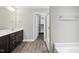 Modern bathroom features a large vanity, walk-in closet, and separate shower area at 622 Lone Pine Loop, Fuquay Varina, NC 27526