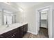 Spacious bathroom with double vanity sinks and a large mirror at 622 Lone Pine Loop, Fuquay Varina, NC 27526