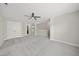 Bright bedroom boasts neutral walls, carpet flooring, and a ceiling fan for added comfort and style at 622 Lone Pine Loop, Fuquay Varina, NC 27526