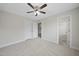 Bright bedroom offers carpet flooring, a ceiling fan, and a closet for storage at 622 Lone Pine Loop, Fuquay Varina, NC 27526