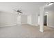 Large bedroom with ceiling fan, and open access to other parts of the home at 622 Lone Pine Loop, Fuquay Varina, NC 27526