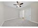 Spacious bedroom featuring neutral carpet, ceiling fan, and convenient closet access at 622 Lone Pine Loop, Fuquay Varina, NC 27526