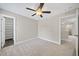 Neutral bedroom with carpet, ceiling fan, and white trim at 622 Lone Pine Loop, Fuquay Varina, NC 27526