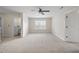 Spacious bedroom features plush carpet, a ceiling fan, and a window that fills the room with natural light at 622 Lone Pine Loop, Fuquay Varina, NC 27526