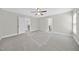 Open bedroom with neutral carpet, ceiling fan, and multiple entry ways at 622 Lone Pine Loop, Fuquay Varina, NC 27526