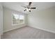 Bright and airy bedroom boasts large window, and a ceiling fan for added comfort and style at 622 Lone Pine Loop, Fuquay Varina, NC 27526