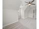 A spacious bedroom with carpet flooring, a modern ceiling fan, and a window for natural light at 622 Lone Pine Loop, Fuquay Varina, NC 27526