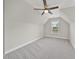 Cozy bedroom with neutral colored walls, carpet flooring, a ceiling fan, and a bright window view at 622 Lone Pine Loop, Fuquay Varina, NC 27526