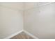Walk in closet features hanging wire shelves and plush carpet flooring at 622 Lone Pine Loop, Fuquay Varina, NC 27526