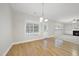 Bright living area with hardwood floors, fireplace, and access to the backyard through glass doors at 622 Lone Pine Loop, Fuquay Varina, NC 27526