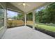 Covered patio features a ceiling fan and screened in walls at 622 Lone Pine Loop, Fuquay Varina, NC 27526